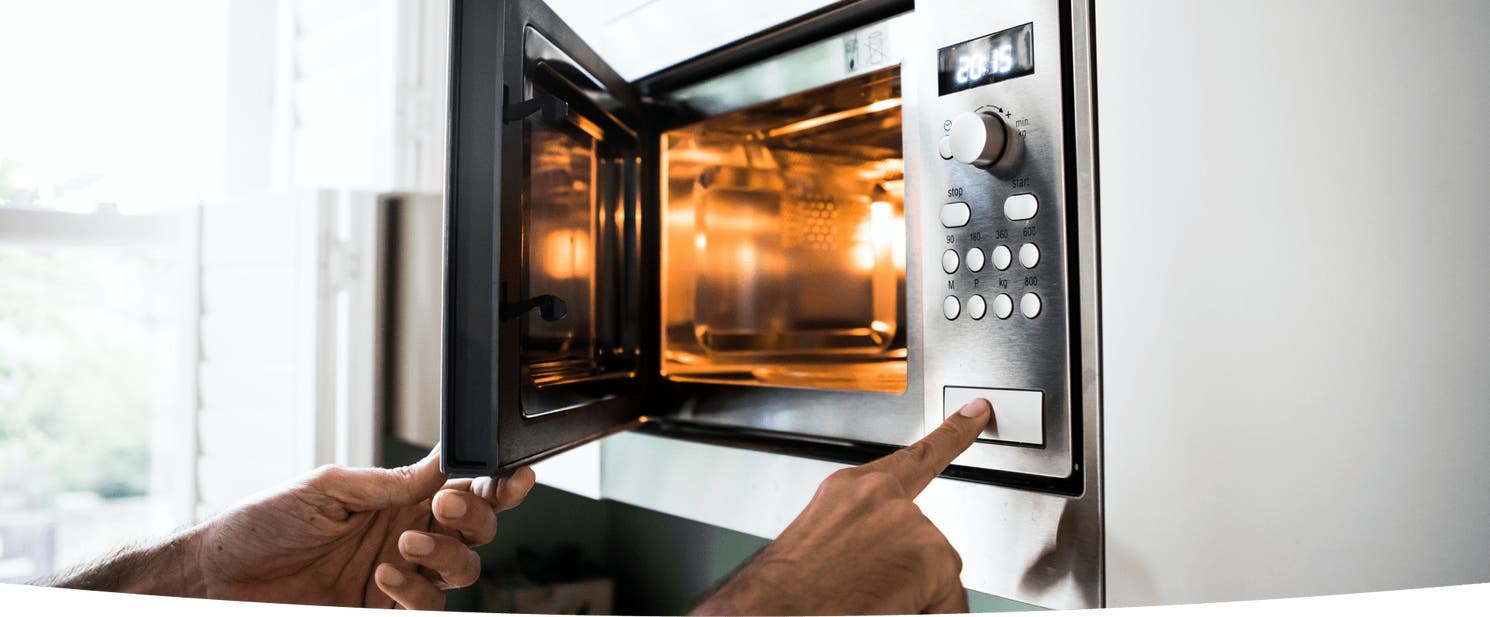A microwave being opened to debunk microwave myths.