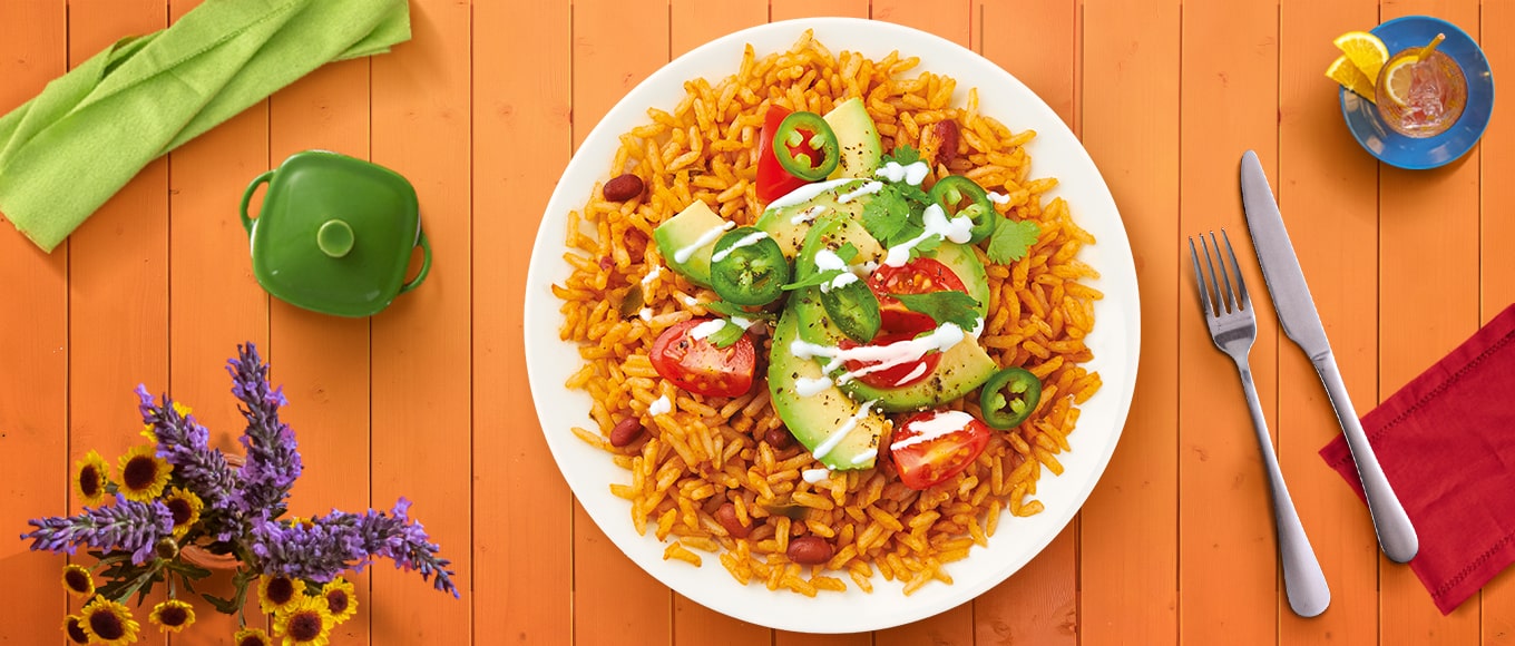 A classic bean burrito bowl recipe with chipotle dressing made in less than 30 minutes with a stovetop and microwave.