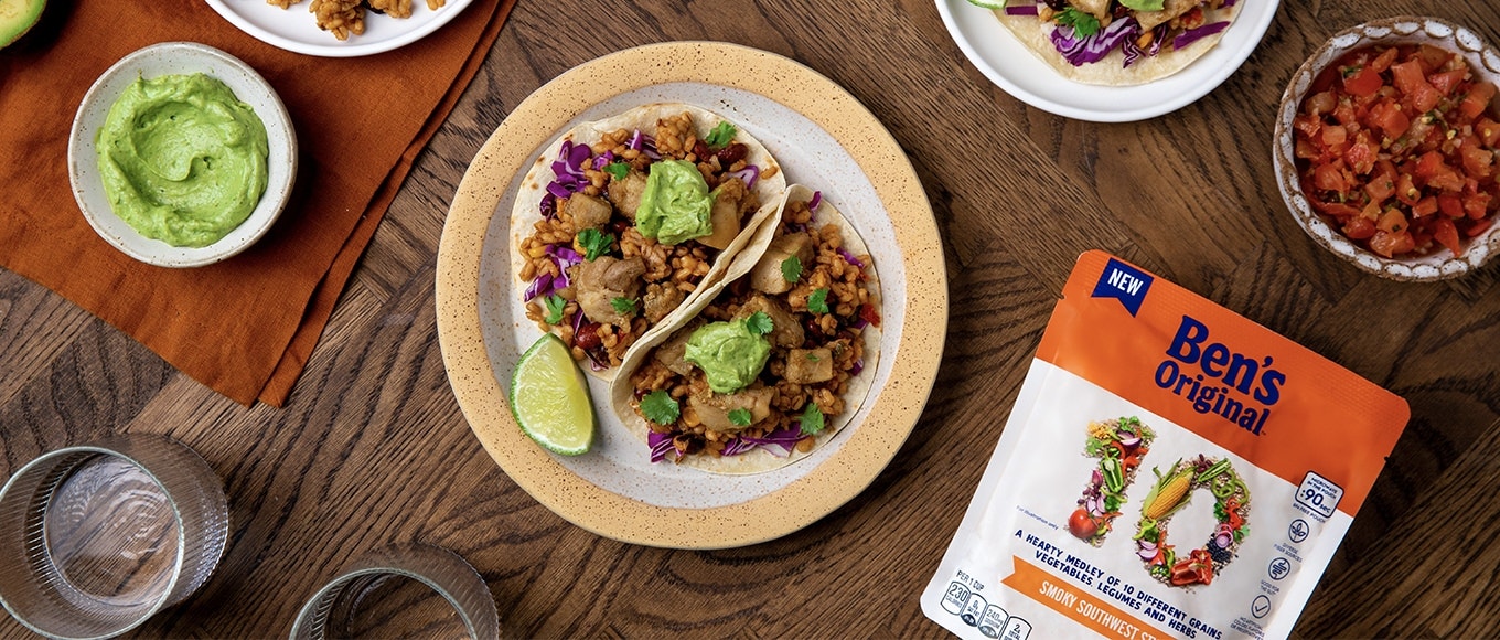 Ben's 10 Medley rice package - Smoky Southwest flavor - on table next to plate of tacos, sides and cups of water