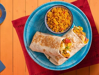 A loaded chicken and rice burrito recipe that can be made in less than 40 minutes with a stovetop and microwave.