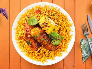 A Portuguese-style peri-peri sauced chicken salad recipe made in less than 50 minutes with a stovetop, microwave, and oven.