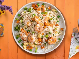 A bowl of shrimp fried rice, made from a recipe that takes less than 30 minutes to make.