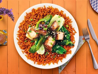 A juicy pork tenderloin paired with slaw and savory Spanish-style rice all in one-recipe.