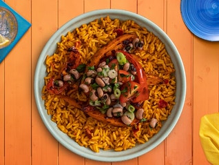 A bean and sweet potato burrito bowl recipe made in less than 45 minutes with a stovetop, microwave, and oven.