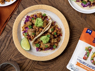 Ben's 10 Medley rice package - Smoky Southwest flavor - on table next to plate of tacos, sides and cups of water